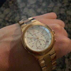 Michael Kors rose gold watch.